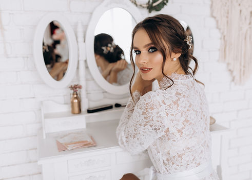 young-bride-is-looking-happily-mysteriously-camera.jpg
