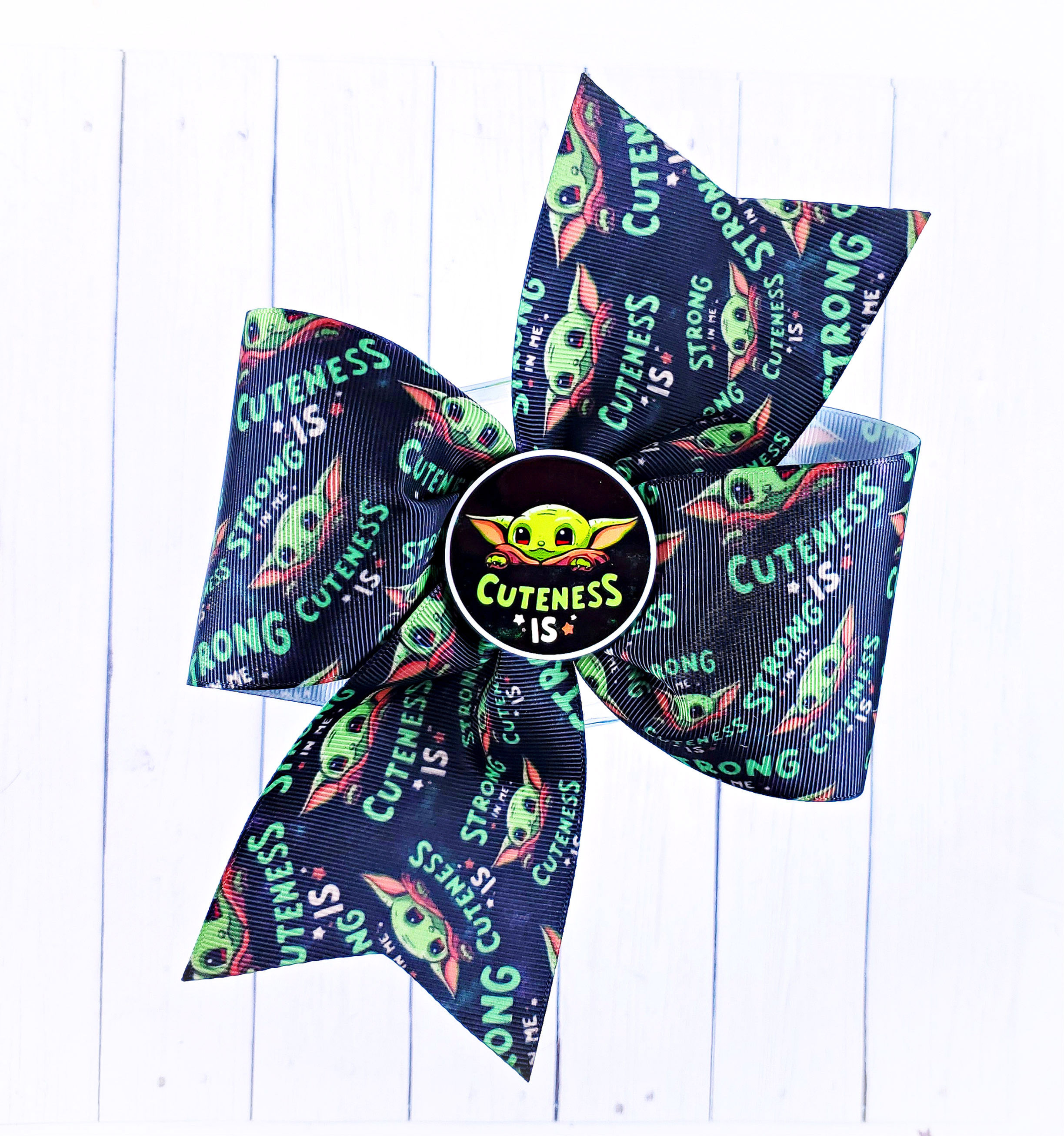 'Strong in Me Cuteness is' jumbo pinwheel bow