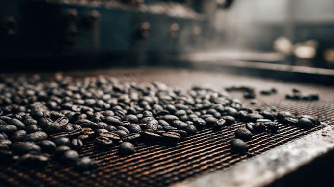Dark Roast Coffee In Cooling Tray.png