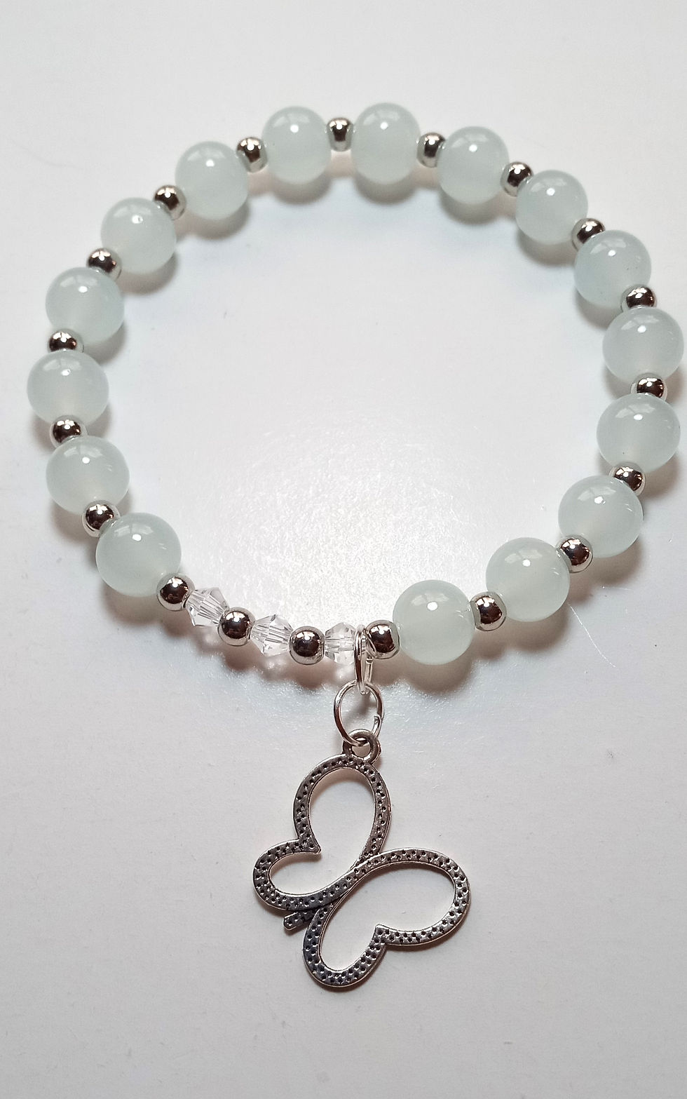 Thumbnail: Light grey beads, butterfly