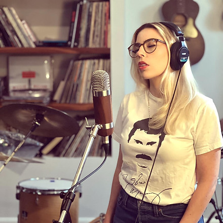 leMeow in her element laying down a vocal track in the recording studio.