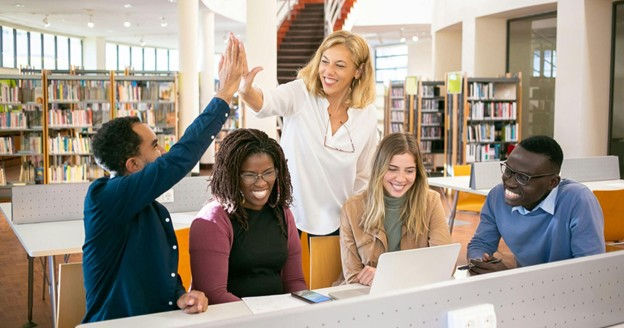 Teens receiving guidance and support from program facilitators in South Florida mental wellness session.