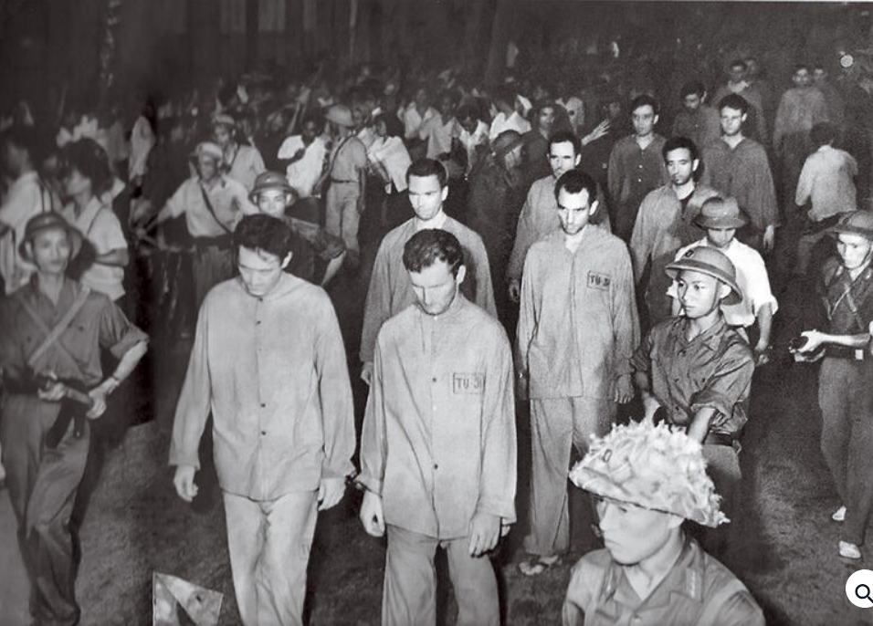 American prisoners of war forced to march in a Hanoi parade that turned violent, 1966.