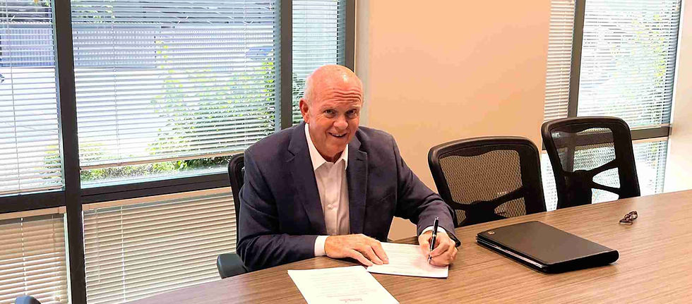 John Cox meeting with business owners at a conference table in a Scottsdale Arizona office