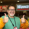 special needs adult who works at wawa wiping up coffee with a rag who is giving a thumbs u