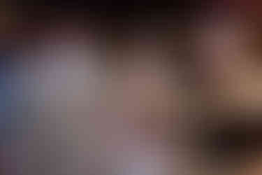 Bride Devina and groom Rishabh dance with pure joy at their Moon Palace Cancún welcome party. Under glowing string lights, Devina twirls in her pastel embroidered lehenga while Rishabh, in a beige suit, laughs with energy. Friends surround them on the dance floor, cheering and clapping, as the celebration comes alive with music and love.