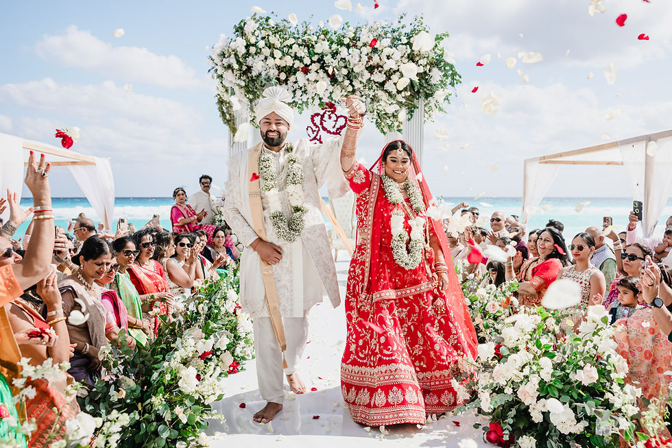 Scenic beachfront Hindu wedding with traditional mandap setup in Riviera Maya