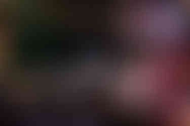 Groom shares an emotional dance with his mother under a canopy of twinkling string lights at Garza Blanca Puerto Vallarta. The intimate moment is surrounded by elegant reception tables adorned with roses and candlelight.