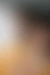 Artistic close-up portrait of Bhavik and Rhia during their Pithi and Haldi at Garza Blanca Cancun, wearing coordinated yellow outfits with intricate embroidery and elegant jewelry.