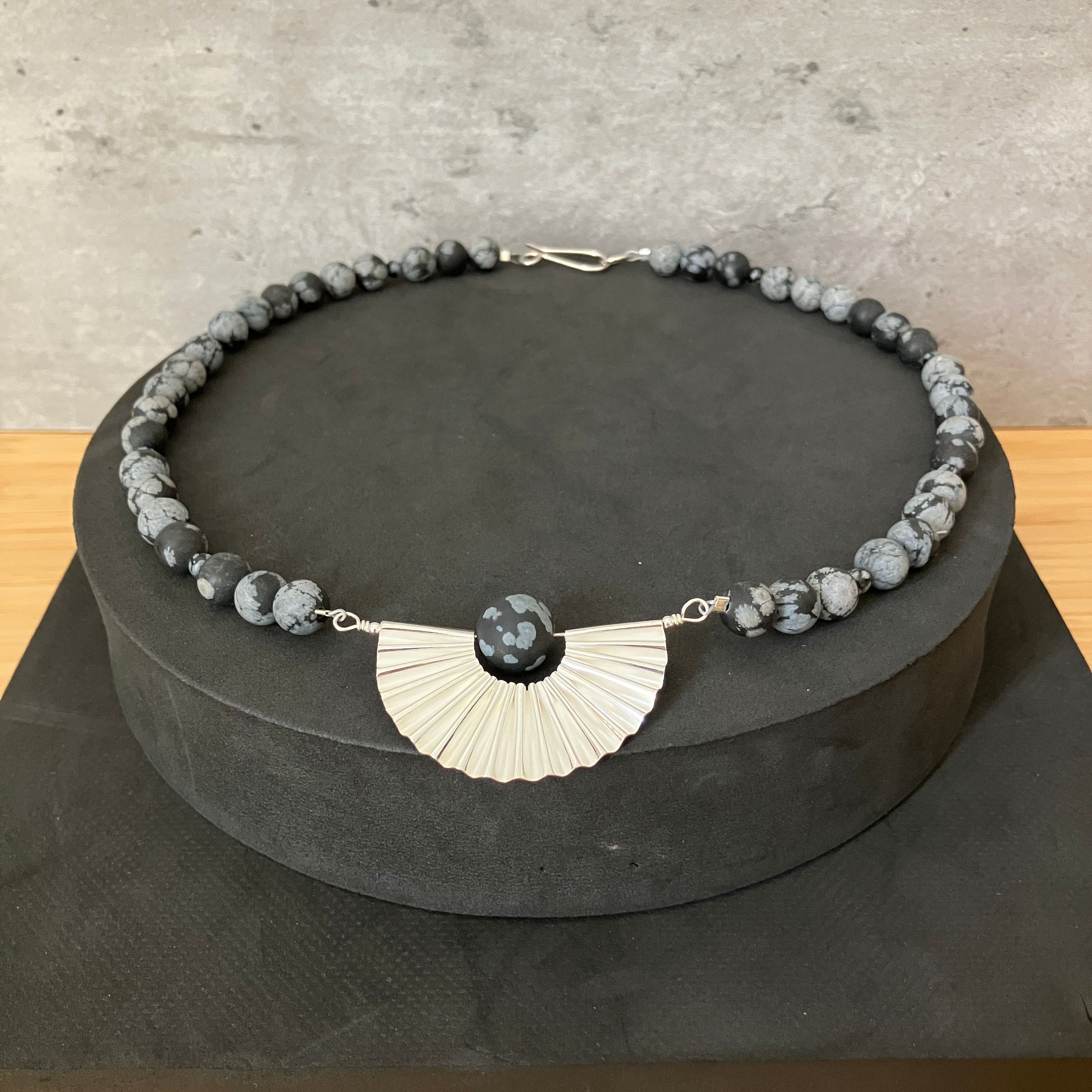 Concertina Curve necklace. Silver and Snowflake Obsidian