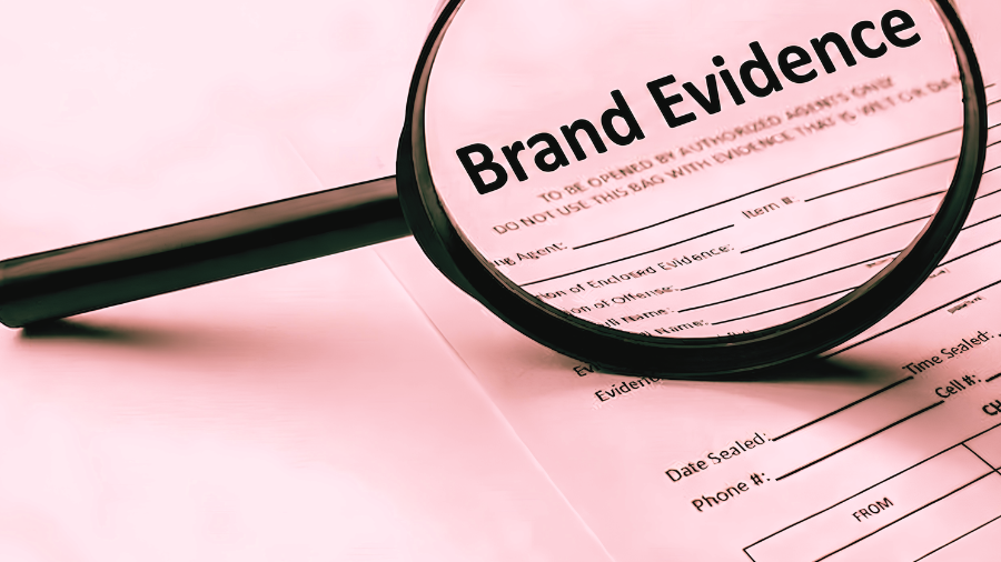 An image of a magnifying glass on 'Brand Evidence' conveying a need to create a personal brand campaign as evidence of a successful career.