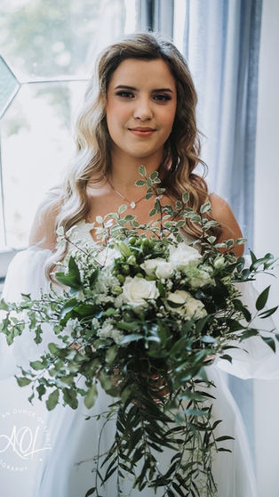 Smiling bride in bridal makeup.