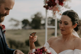 Bride with smokey eye bridal makeup and deep lipstick.