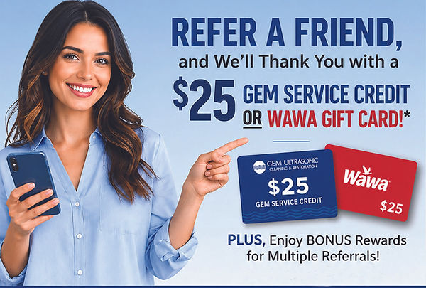 Pretty dark-haired woman holding a cell phone is pointing to a referral program special REFER A FRIEND and get a $25 Gem Service Credit or Wawa Gift Card*