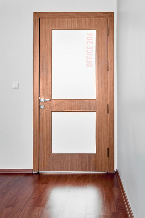 Office door with 3M Fasara Window Film installed. 