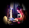 DJ Simone Fougere deejaying at night