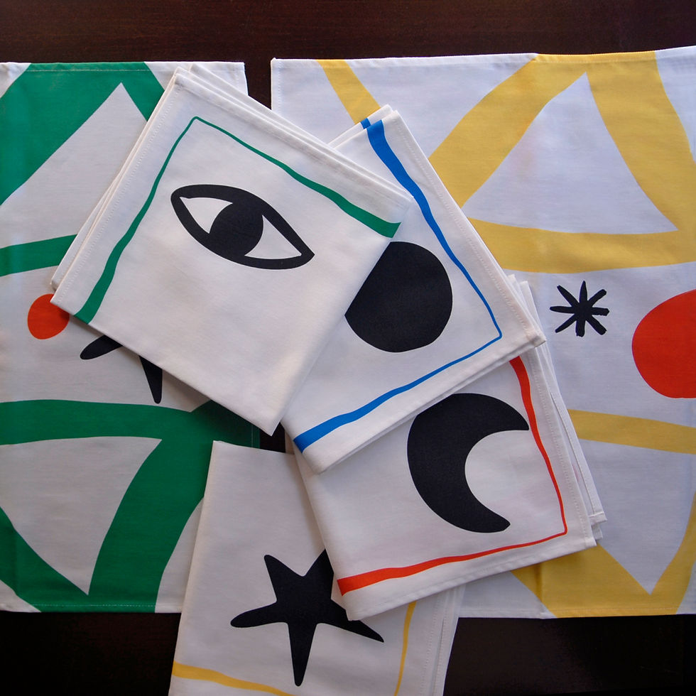 Thumbnail: Folded napkins with abstract eye, moon, and star designs
