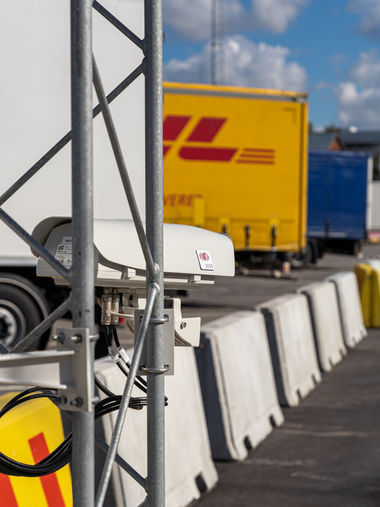 Container passing through the ADDS imaging portal with high-resolution cameras scanning for structural damage