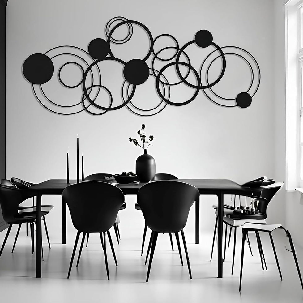 Modern dining room with a black table set, black chairs, and wall art of overlapping black circles. Minimalistic and elegant design.