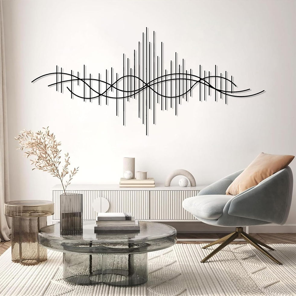 Modern living room with abstract wall art, a round glass table, a vase, and a gray armchair with a beige pillow. Neutral tones and minimalist decor.