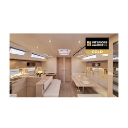 Interior of Amelie Sailing Yacht showing light, warm, and powdery design with natural oak, white lea