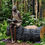 Thumbnail: large seated girl sculpture reading 