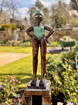 Foundry bronze garden sculpture ‘Wanda’ by Dawn Conn, depicting a powerful female swimmer 