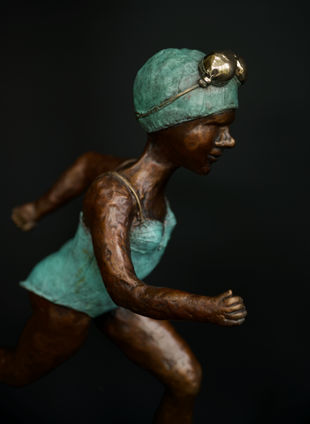 swimming art. sculpture. running. bronze sculpture