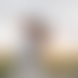 Romantic couple in a valley wearing white