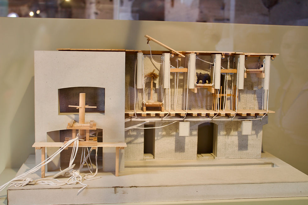 A wooden diorama of what the ancient pulley system bringing animals up to the stage once looked like.