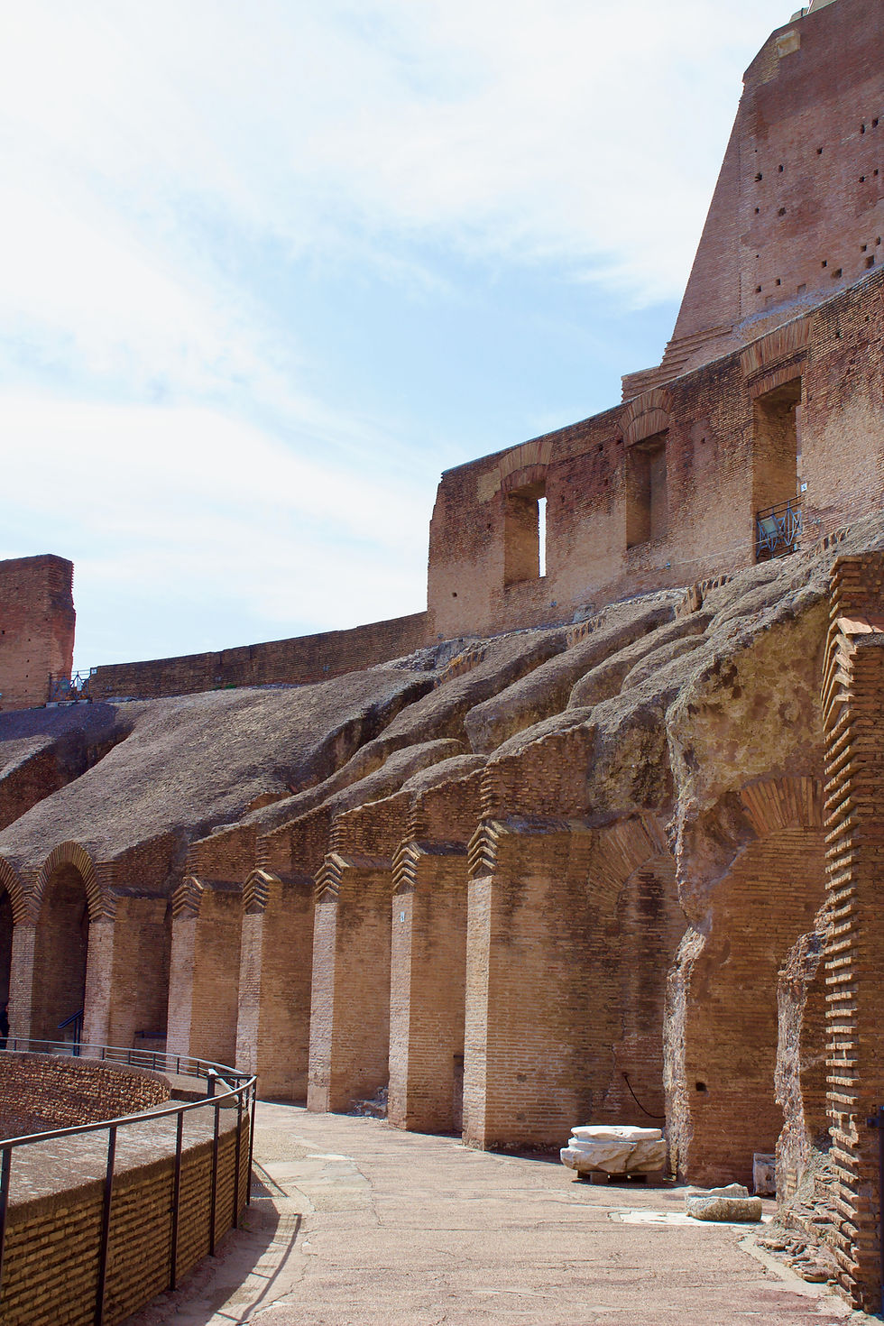 A walkway in one of the Colosseum's upper tiers. The red stone and brick is in quite good condition after nearly two thousand years.