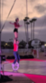 Duo Unicycle performers stand tall at the San Diego Fairgrounds