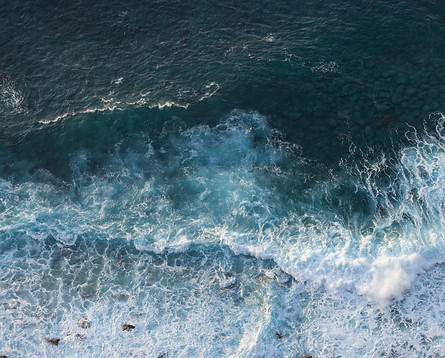 Arial view of sea and waves crashing