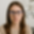 Woman wearing blue light glasses during an eye exam, representing discussion on the effectiveness of blue light glasses by Alexandria eye doctors at Nova Eye Care Center.