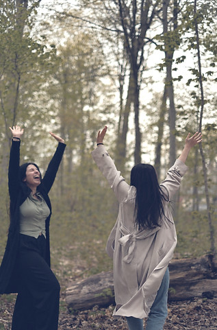 Two sisters in a forest representing freedom, spiritual connection, intuitive guidance, and emotional healing
