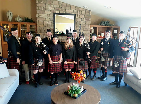 Full band with instruments and kilts