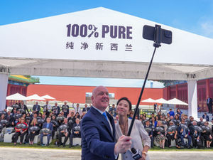 NZ PM Christopher Luxon taking selfie in China