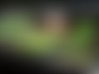 Man watching microgreens grow