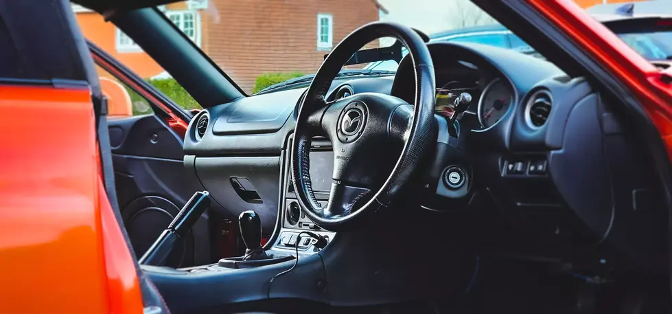 a steering wheel with a mazda logo on it