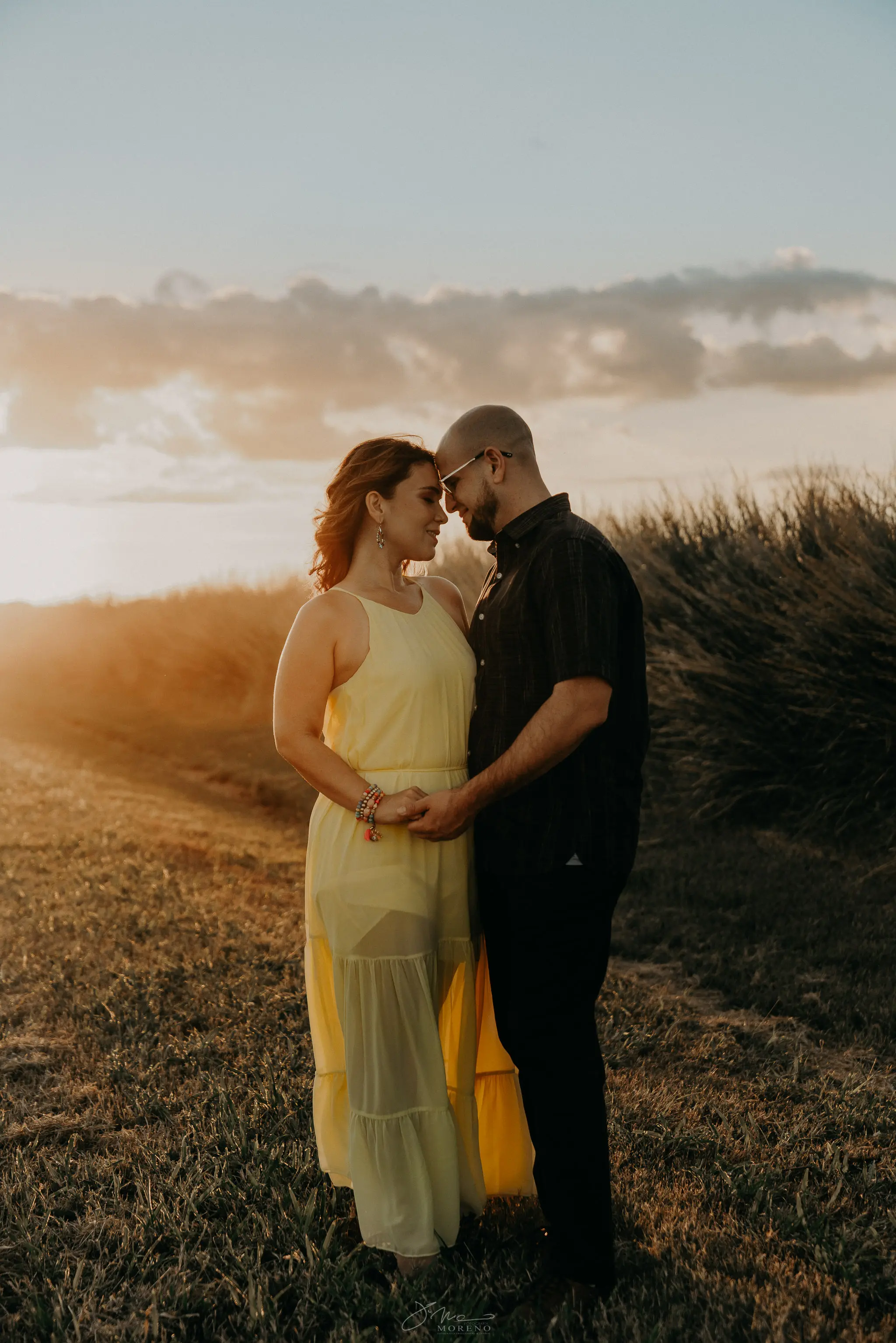 Couple dancing at sunset celebrating anniversary posing for photo shoot in Puerto Rico
