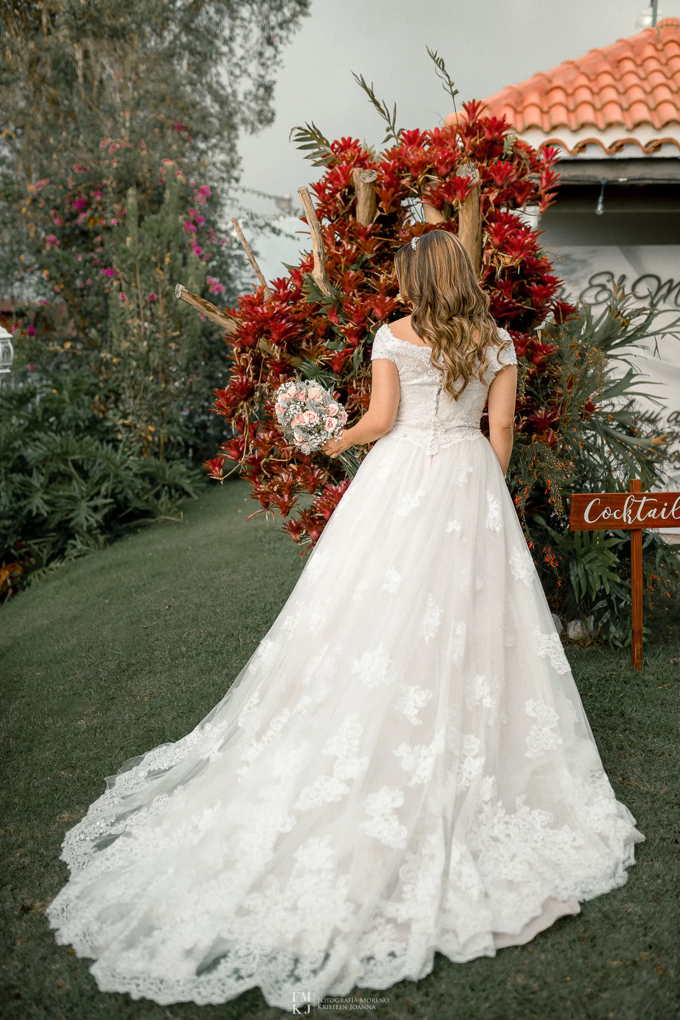 bride posing at the garden with bouquet