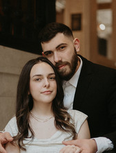Engaged couple sharing a romantic moment inside Book Tower in Detroit, captured by luxury wedding photographer Disjah Lyons.