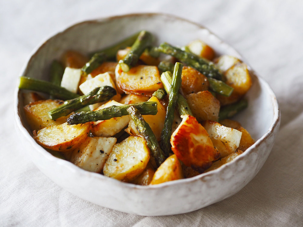IN THE KITCHEN POTATO, HALLOUMI + ASPARAGUS BAKE