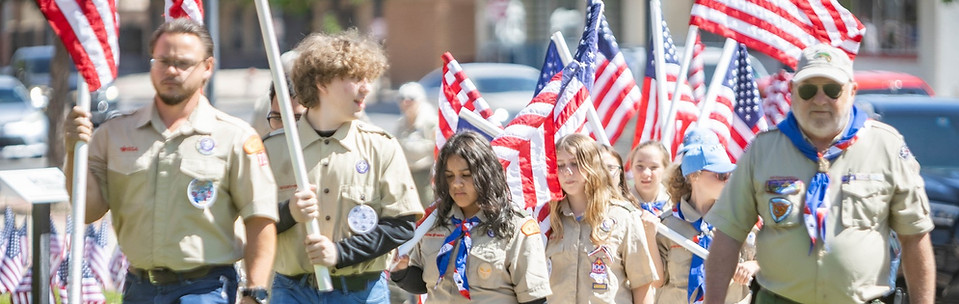 Scouts putting up flags for 4th of July
