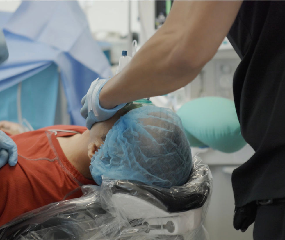 Medical Anesthesiologists Placing A Mask on a Patient