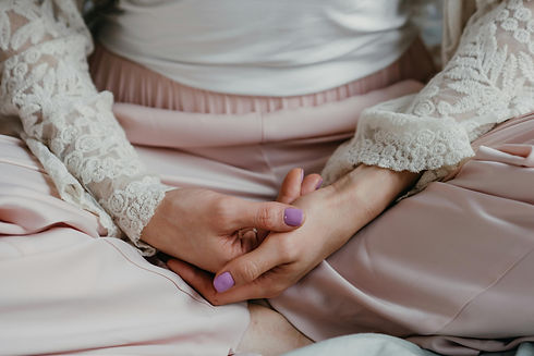 Image of woman sitting holding hands grounding
