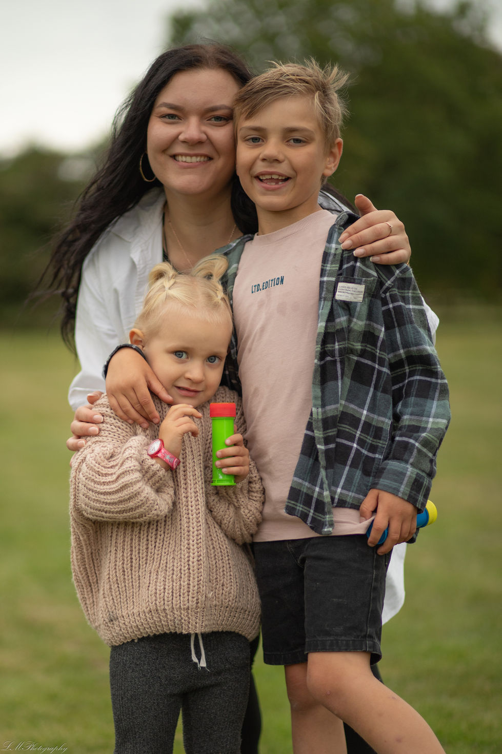 a boy wearing a shirt that says ita caution