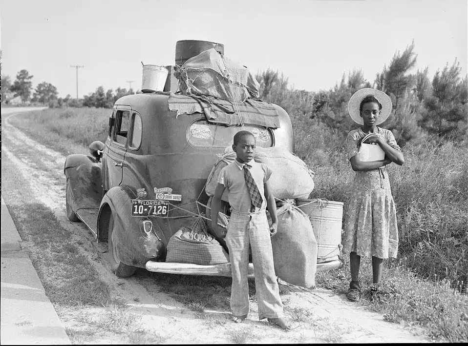 Rural Southern Black family during the Great Migration era, early 20th century porch or farm scene