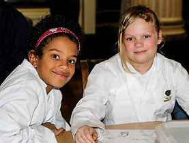 Two pupils in lab coats
