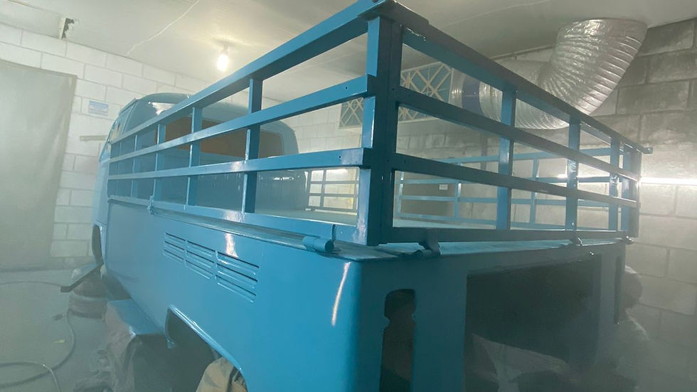 photo of vw single cab being painted in spray booth